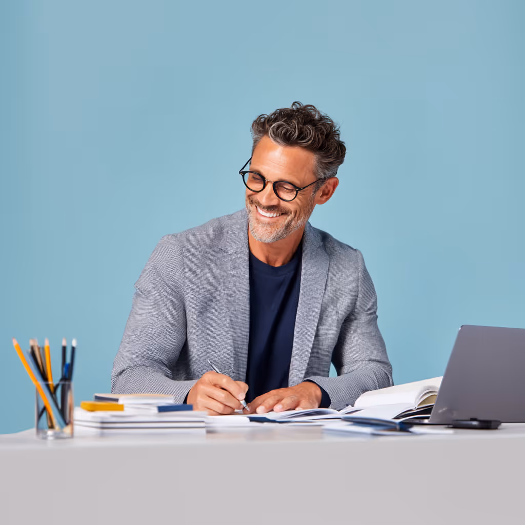 Man working at desk, focused and engaged